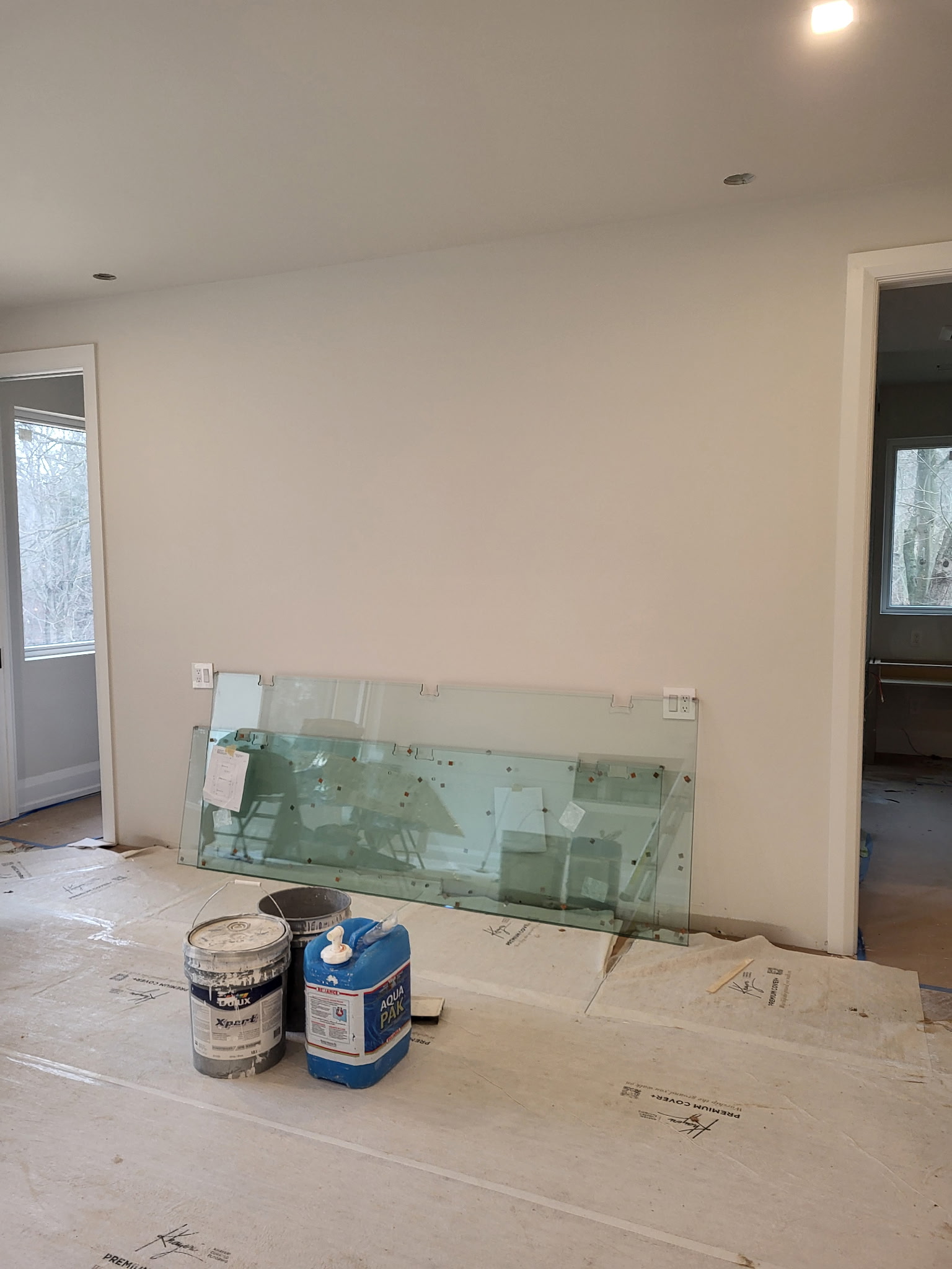 Freshly finished interior with new drywall, paint and recessed lighting